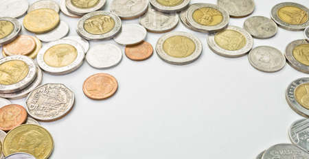 Thai coins isolated on white leaving space in the middle  Able to use as background の写真素材