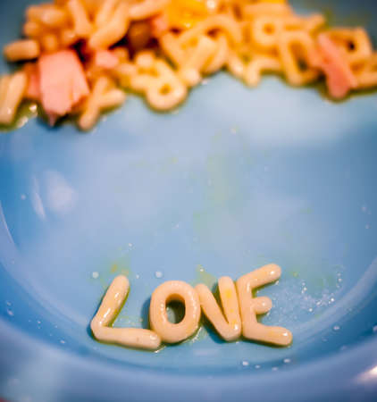 Love word arranged from spaghetti alphabets for kidsの写真素材