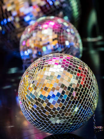Disco ball and reflection in the darkの写真素材