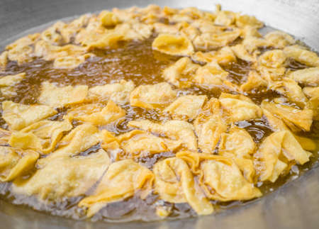 Deep fried wonton, or dumpling in the frying panの写真素材
