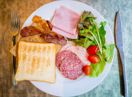 Food in plate in contrast of good and bad breakfast