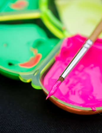Paintbrush with plastic palette symbolize of beginner artistの写真素材