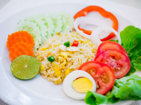 Fried rice with boiled egg slice and salad symbolize of healthy food