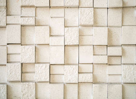 Artificial stone wall tile showing geometry pattern in beige colorの写真素材
