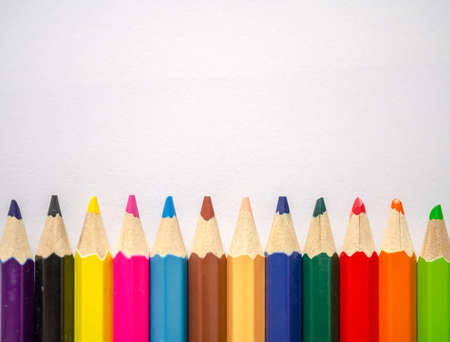 Colored pencil isolated on grey textured art paperの写真素材