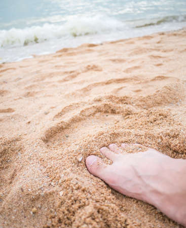 Barefoot on the beach symbolize of the natural relaxationの写真素材
