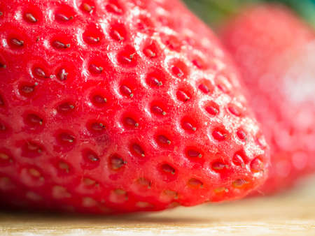 Macro shot of strawberry tip showing the seedsの写真素材