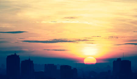 Cityscape sunrise cross processed in retro styleの写真素材