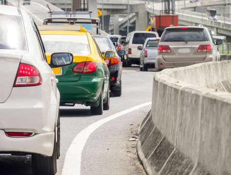 Car queue in the bad traffic road. Selective focus.