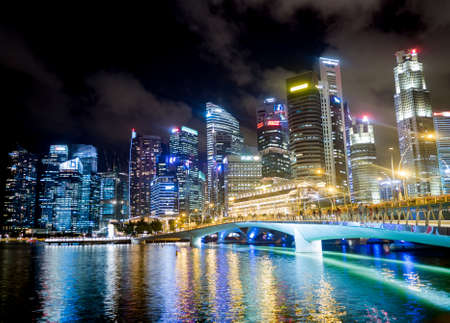 SINGAPORE - AUGUST 24, 2016 : Cityscape of the business buildings at night of Marina Bay in Singaporeのeditorial素材