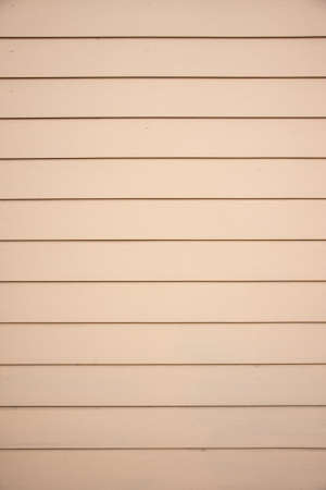 modern wall of cement have brownish color and applied similar woodの写真素材