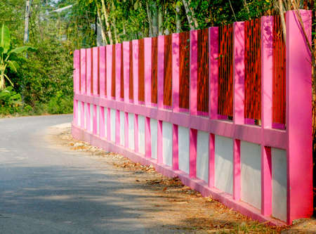 beautiful pink painting on cement fenceの写真素材