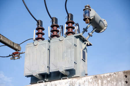 gray transformer on substations with blue sky