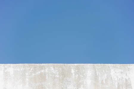 edge of wall roof of building with blue skyの写真素材