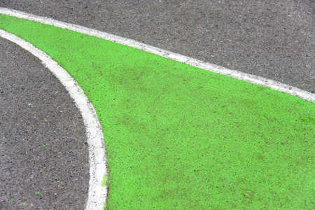 old curve texture of playground outdoor basketball court made of asphalt and painted greenの写真素材