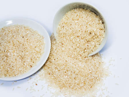 Rice spill on white floorの写真素材