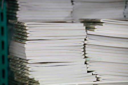 Pile of books on black wooden shelfの写真素材