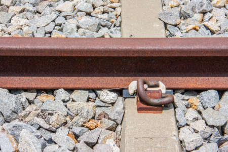 close-up of rail fastener with concrete sleeperの写真素材