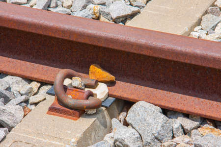 close-up of rail fastener with concrete sleeperの写真素材