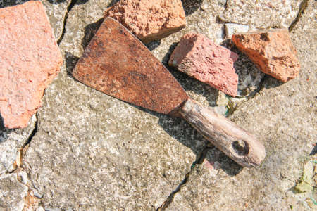 old steel trowel on old cement floorの写真素材