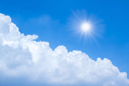 sun rays in bright day with blue sky and clouds