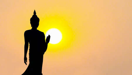 silhouette of buddha statue with sunset in evening, Phutthamonthon park Nakhonpathom, Thailandの写真素材