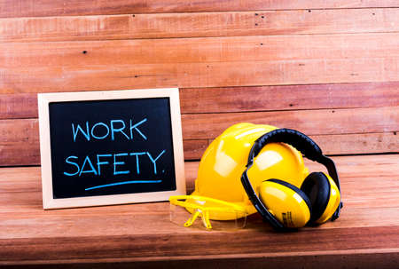Standard construction safety equipment on wood backgroundの写真素材