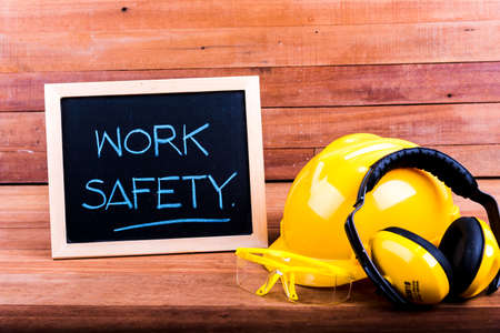 Standard construction safety equipment on wood backgroundの写真素材