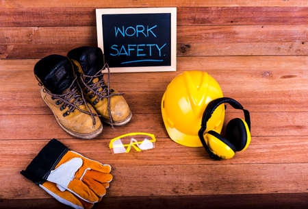 Standard construction safety equipment on wood backgroundの写真素材