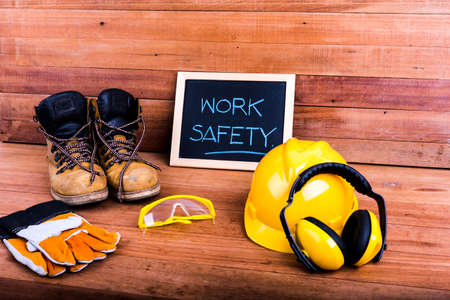 Standard construction safety equipment on wood backgroundの写真素材