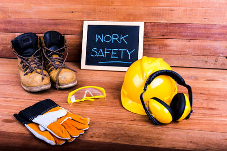 Standard construction safety equipment on wood backgroundの写真素材