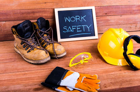 Standard construction safety equipment on wood backgroundの写真素材