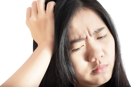 Headache symptom in a woman isolated on white background.の写真素材
