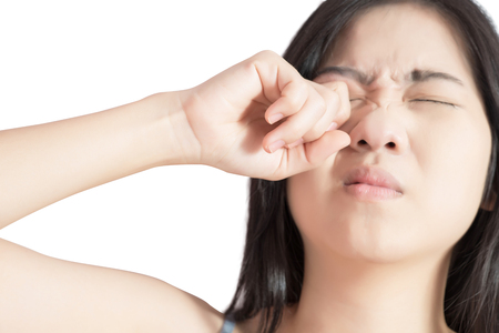 Eyes pain and eyes strain in a woman isolated on white background.の写真素材