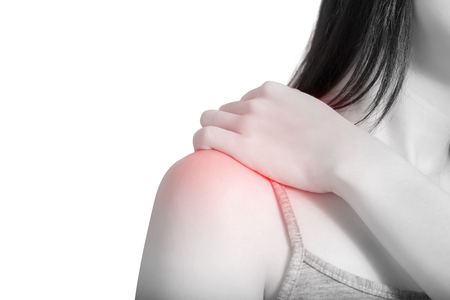 Backache or Painful shoulder in a woman isolated on white background.の写真素材