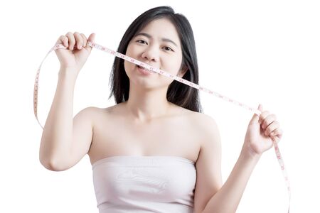 Woman measuring obese isolated on white background .の写真素材