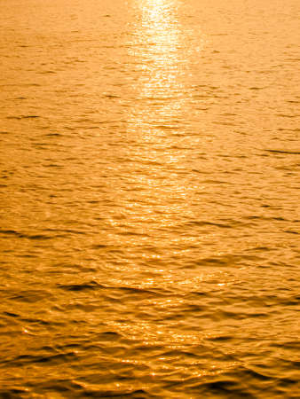 Reflective sun on water abstract  backgroundの写真素材