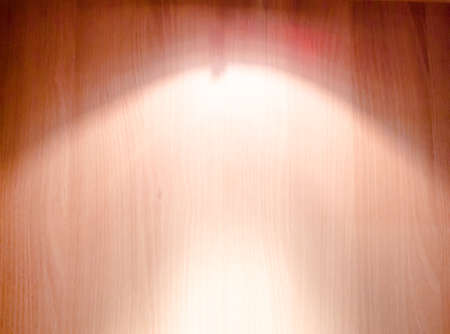 ray of spotlight on wood wallの写真素材