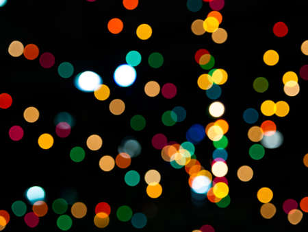 Abstract colorful bokeh on black backgroundの写真素材