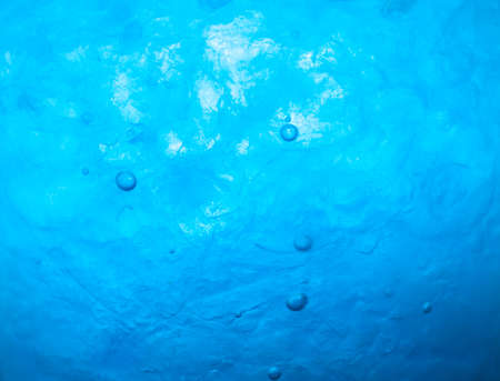 close up blue soda drink with ice