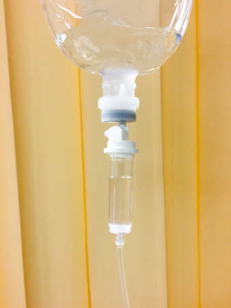 Close up saline solution drip for patientの写真素材