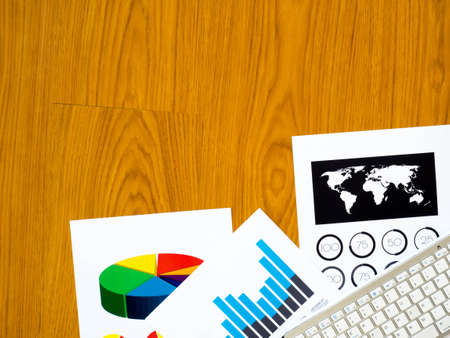 Top view of office desk with paper backgroundの写真素材