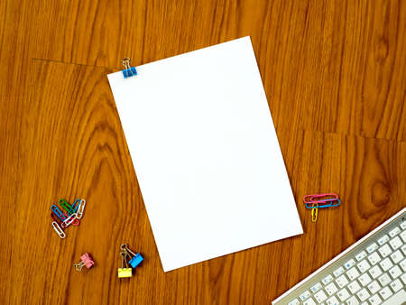 Top view of office desk with paper backgroundの写真素材