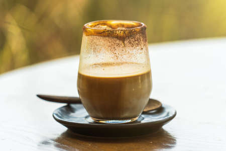 close up cup of coffee on wooden table