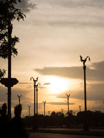sunset at road with swan lamp street in silhouette toneの写真素材