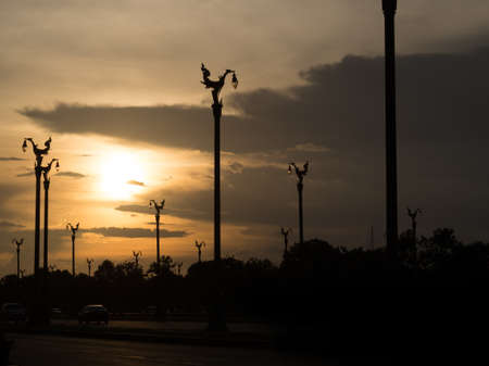 sunset at road with swan lamp street in silhouette toneの写真素材