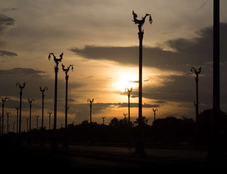 sunset at road with swan lamp street in silhouette toneの写真素材