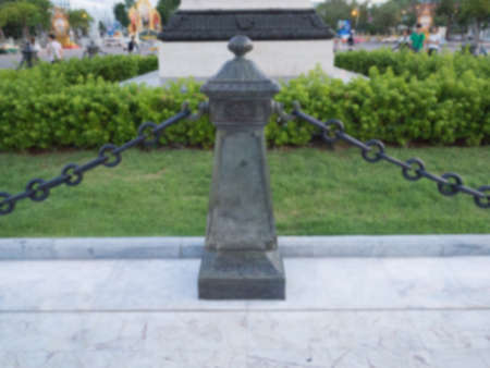 stone fence in park on blur backgroundの写真素材