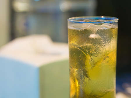 beer in glass on blur backgroundの写真素材