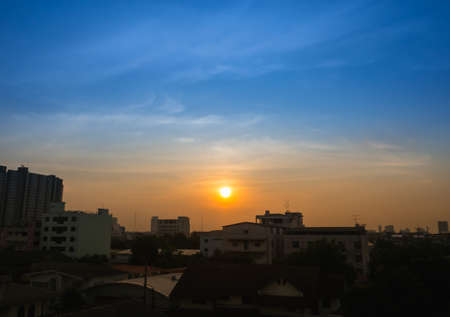 dramatic city in twilight with sunsetの写真素材
